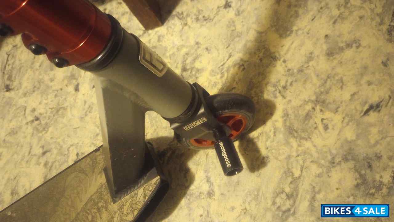 Black/orange Mongoose Rise 100 Pro Scooter