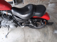 Red Harley Davidson XL1200N Nightster