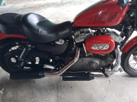 Red Harley Davidson XL1200N Nightster